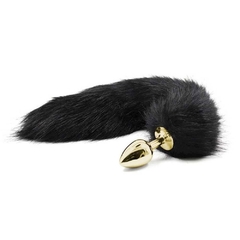 Plug de metal dourado com rabo preto