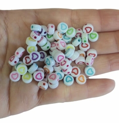 MIÇANGA ENTREMEIO REDONDO CORAÇÃO VAZADO (7MM) - 50 GRAMAS - comprar online