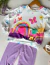 Conjunto Infantil Estampado com Blusa de Arco Íris e calça Lilás na internet