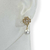 Brinco Folheado a Ouro - Trevo com strass no meio + perola - comprar online