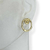 Brinco Banhado Dourado - Pino oval com oval vazado - comprar online