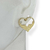 Brinco Banhado Dourado - Coração vazado com meio preenchido