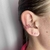 Piercing fake folheado a prata 3 voltas cravejado - Rubi na internet