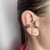 Piercing fake folheado a ouro 3 voltas cravejado - Preto na internet