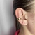 Piercing fake folheado a ouro Cartier na internet