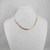 Colar choker escama de peixe com textura folheado a ouro