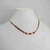 Colar choker folheado a ouro - folhas + 3 circulos cristais vermelho - comprar online
