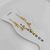 Tornozeleira folheado a ouro - 3 crucifixos + 2 strass na internet