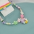 conjunto infantil 3 em 1 - Colar, kit de pulseiras e laço - flor sorriso - comprar online