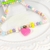 conjunto infantil 3 em 1 - Colar, kit de pulseiras e laço - Coração Pink - comprar online