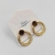 Brinco Circulo Textura de bolinha + Strass - comprar online