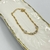 Pulseira Folheado a ouro - Corrente groumet + 2 strass grande entre meio 4 strass
