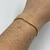 Bracelete Folheado a ouro - Design Moderno ondulado na internet