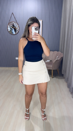 Shorts saia linho botão