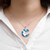 Collar Medialuna Cielo con Nubes Encapsuladas en Acero - Brilla en la oscurida - tienda online