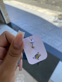 Piercing íntimo coração cravejado na internet