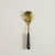 Cuchara de ensalada Volos dorada con negro en internet
