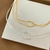 CHOKER DESIGN ENTRELAÇADO BANHO PRATA 925 na internet
