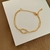 PULSEIRA DESIGN ENTRELAÇADO BANHO OURO 18K na internet