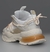 Zapatillas Aglet en color blanco con detalles en beige y suela con amortiguación naranja, vistas desde atrás.