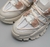 Zapatillas Mita Aglet en colores neutros con detalles en tela y suela robusta.