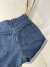Short Feminino Jeans Mom Barra Dobrada na internet