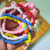 Kit colar e pulseiras Arco Íris na internet