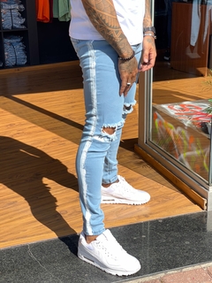 calça jeans super skinny colin azul clara faixa lateral