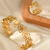 Conjunto Anel e Bracelete Flores Aço Inox Ouro 18k - comprar online