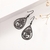 Brinco Gota Flor Aço Inox Black Color na internet