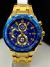 1• linha A+ - edifice perpetual - funcional data e hora - vidro cristal - dourado /azul