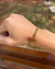 Cordão Grummet 7mm/70cm + Pingente Cruz + Bracelete de Brinde - Ouro - loja online