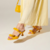 MULE DE SALTO FLARE MÉDIO EM COURO VERNIZ AMARELO HONEY COM LAÇOS - comprar online