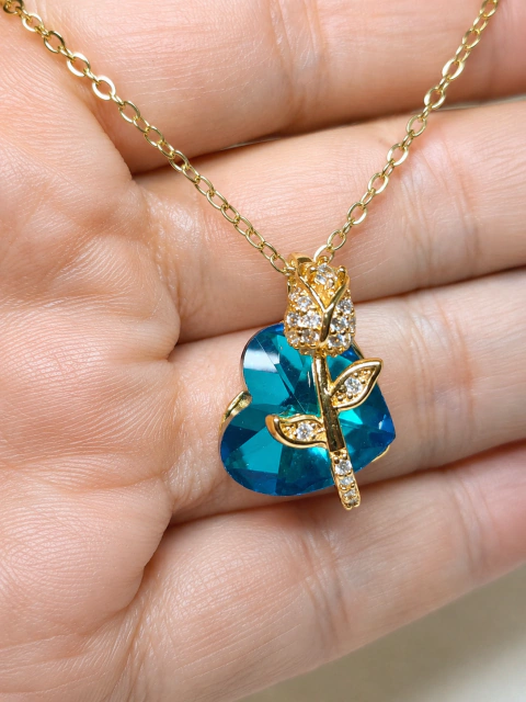 Dije corazón azul turquesa con tulipán