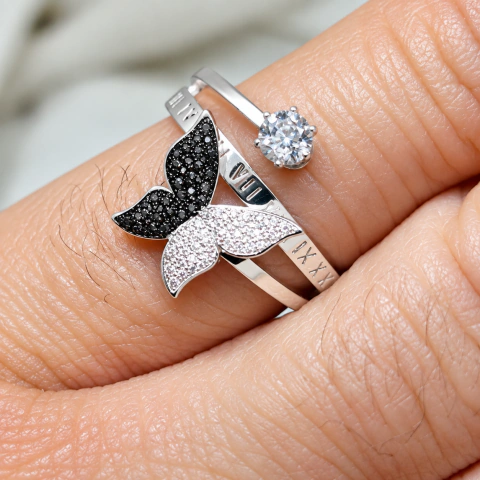 Anillo acero blanco mariposa y punto de luz