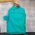 MOCHILA UP4YOU NYLON TURQUESA C/POMPOM MS47151 - comprar online