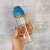 GARRAFA PLÁSTICA 450ML C/CANUDO REI LEÃO na internet
