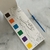 BLOCO P/COLORIR COM AQUARELA DINO LEO E LEO - Graciosa Presentes