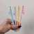 CANETA GEL APAGÁVEL C/ PINGENTE ESTRELA LEO E LEO