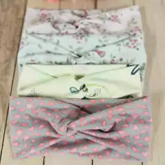 Imagen de VINCHA DE TELA CRUZADA X 6