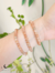 Pulseira esfera pedra da lua pêssego - Autoconhecimento - comprar online