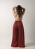 Calça de moletinho pantalona terracota com elástico na cintura e bolsos fundos