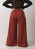 Calça de moletinho pantalona terracota com elástico na cintura e bolsos fundos
