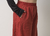 Calça de moletinho pantalona terracota com elástico na cintura e bolsos fundos