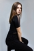 Body feminino preto com detalhes em transparência e manga curta