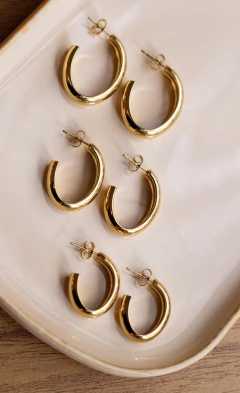 Brinco Oval Aço - P M G na internet