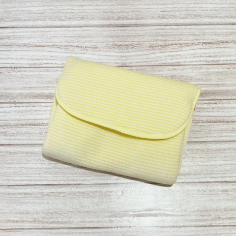 Cambiador portátil rayadito blanco & amarillo