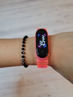 RELOJ TRANSPARENTE- FUCSIA