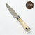 Cuchillo de acero inoxidable con cabo elaborado en Hueso Liso Doble Alpaca en Vaina de Cuero