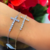 Pulseira Cruz Prata 925 e Banho Ouro 18K na internet